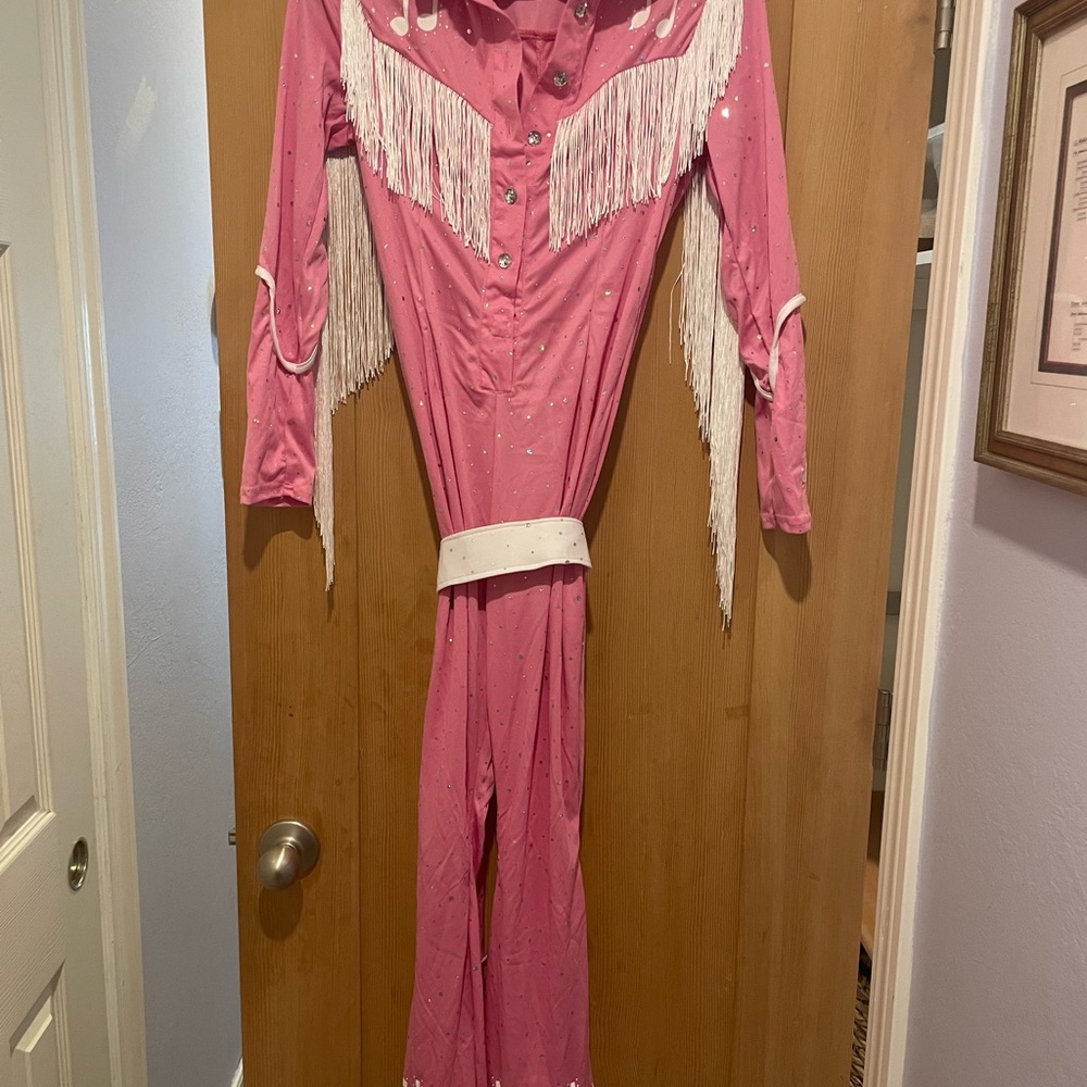 Halloween hot pink women’s jumpsuit with fringe…Dolly Parton?